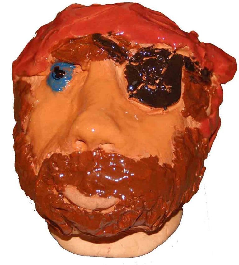 clay head of a blue eyed pirate