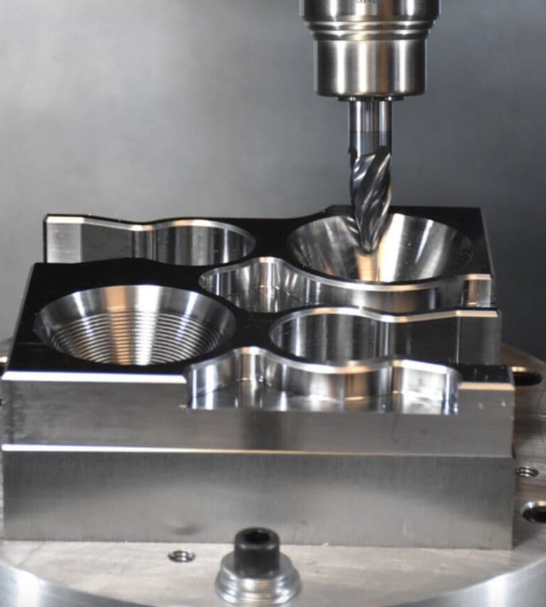 A precision CNC milling machine drills into a polished metal part for industrial manufacturing.