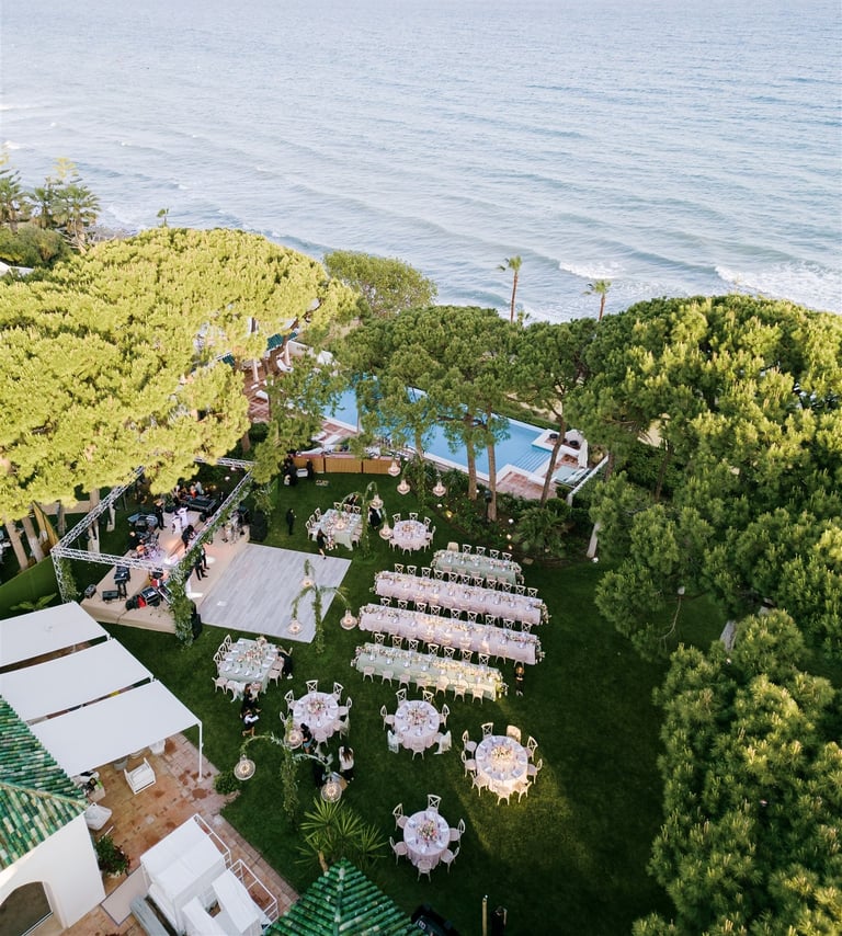Destination wedding setup and altar in the seaside gardens of Villa El Rincon in Marbella