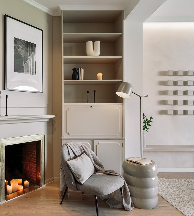 Living area with elegant decor, custom art, and calm beige tones, designed by SAVIA in Barcelona