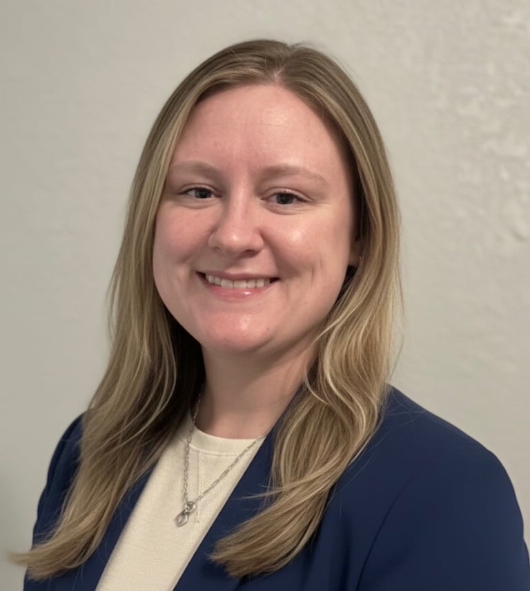 a woman in a blue jacket and white shirt