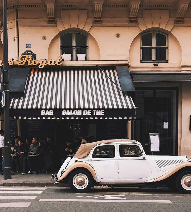 Picture mediterranean atmosphere of a vintage car in front of a Bar