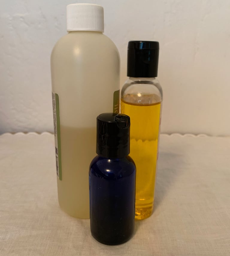 3 bottles of oil, various colors & sizes