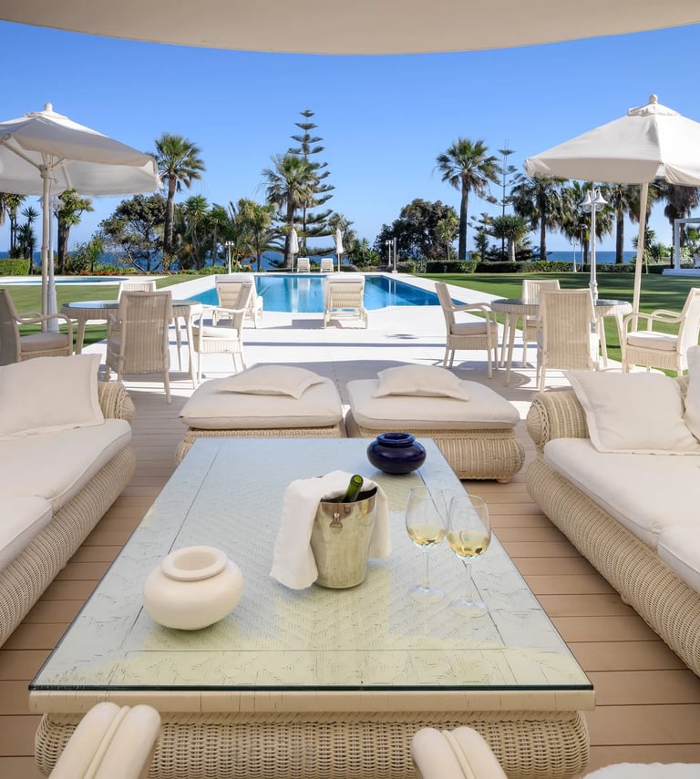 Outdoor lounge area in Marbella beachfront villa