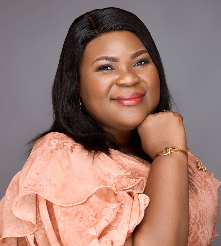 a woman in a pink dress and gold jewelry