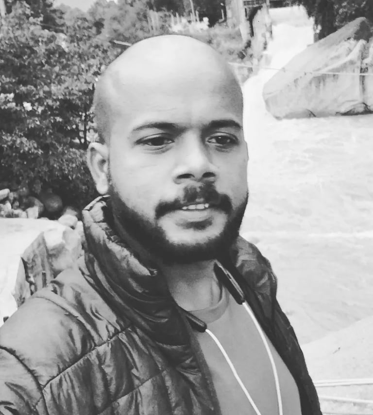 Founder of Rightbrainz media solutions a man with a beard and a beard in a black and white photo