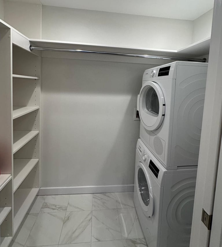 a laundry room with a washer and dryer