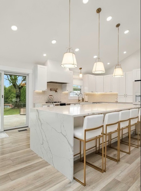 a kitchen with a marble counter top and a marble counter top