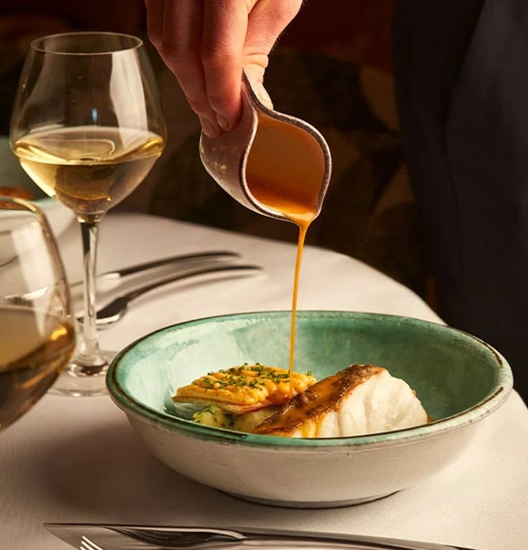 Gourmet dish with sauce at La Môme, The Berkeley.