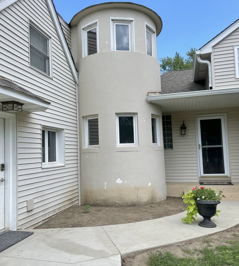 lake geneva home prior to masonry stone facing restoration project completion