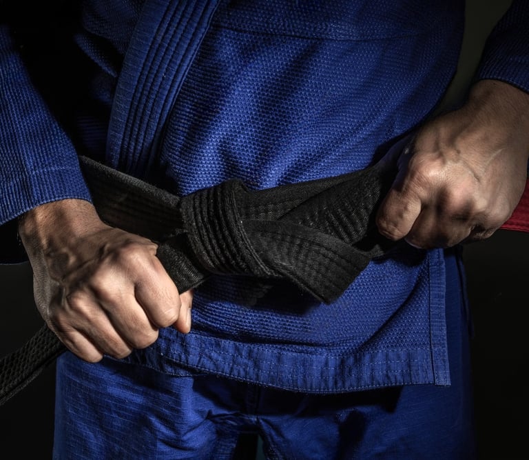 BJJ black belt on blue kimono