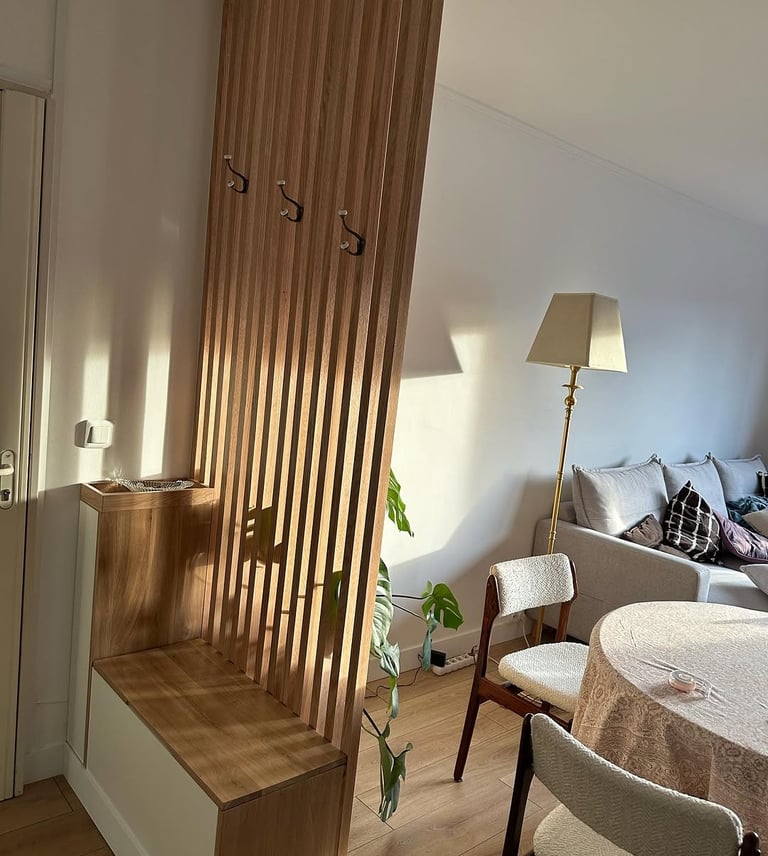 a living room with a table and chairs