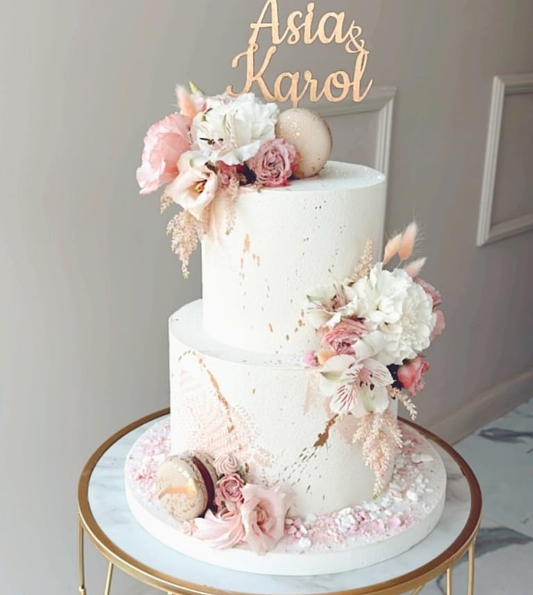 a white cake with a gold cake topperf