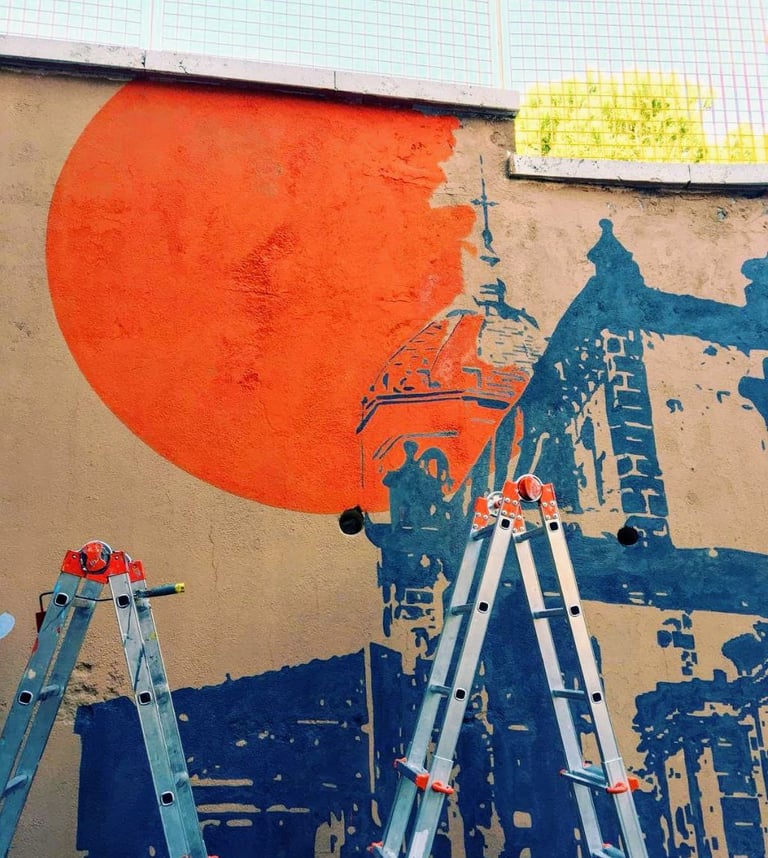 Detail of a mural featuring a large orange sun and blue architecture, created by Poliops using stenc
