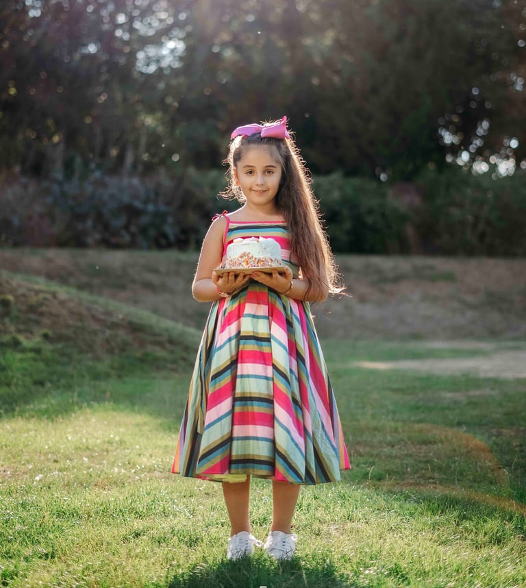 Girl in colorful striped dress posing outdoors – Fred Art Studio session
