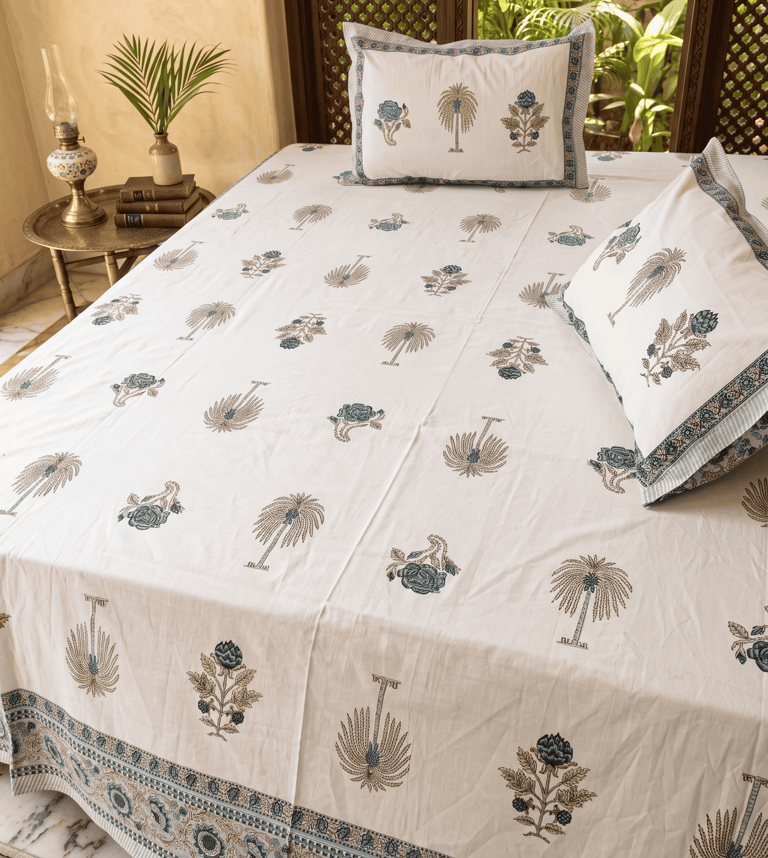 Authentic white cotton Jaipuri bedsheet featuring blue and gold palm tree block print motifs