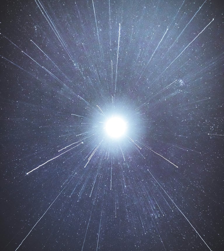 a bright blue sky with stars and a bright light shining through the stars