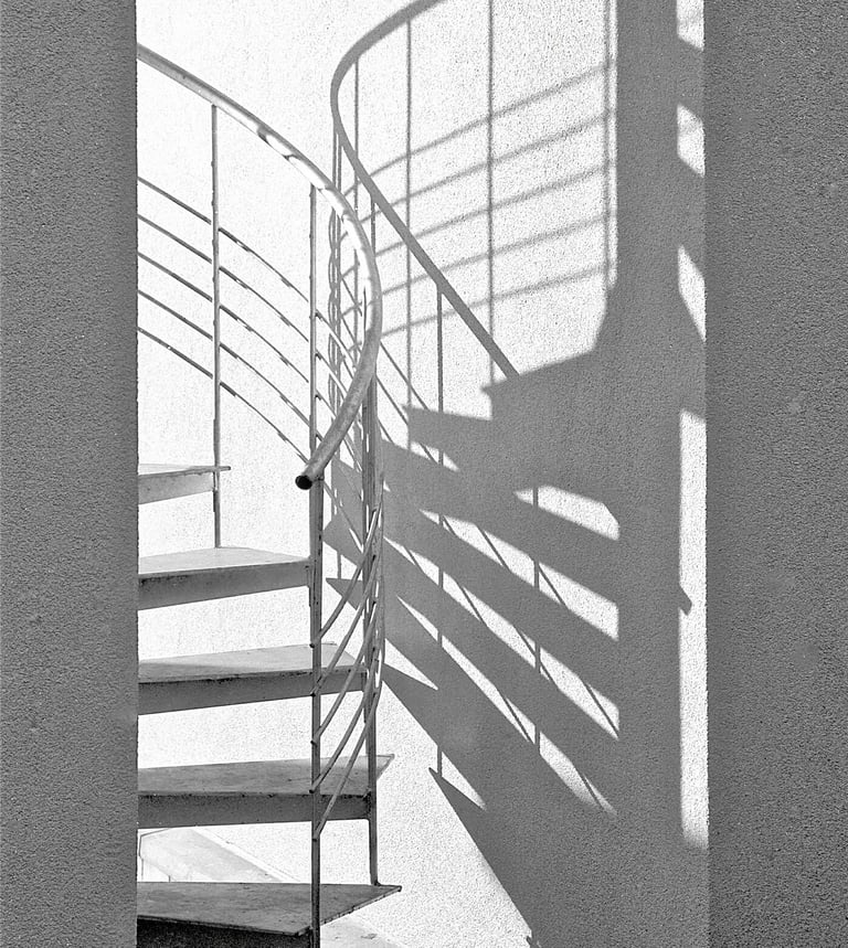 a spiral staircase with guardrails