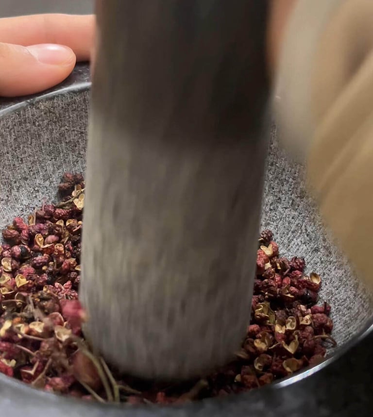 a person is using a grind grinder in a bowl
