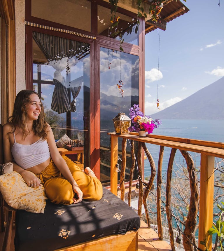 Bask in the warmth of the morning sun with a breathtaking view of Lake Atitlán, where every sunrise.