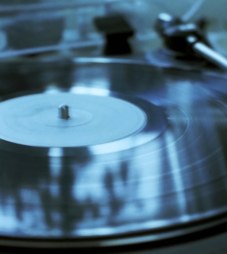 Image of a vinyl record in a turntable