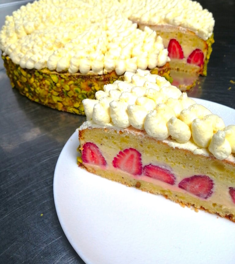 a strawberry cake with a slice of cake on top of it