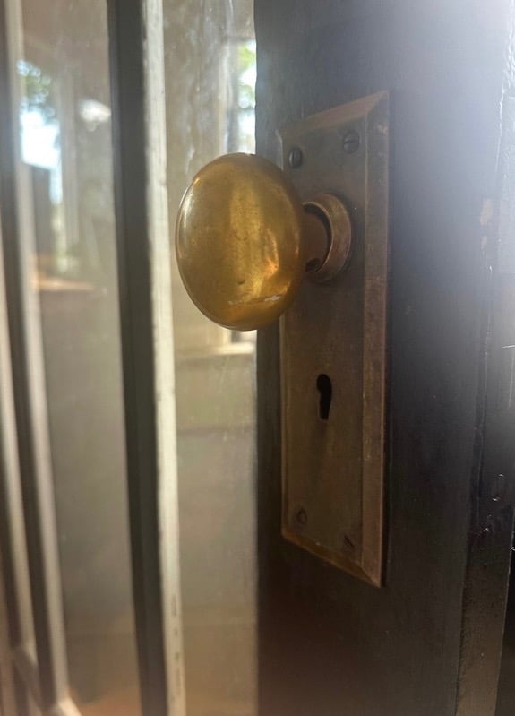 Chrome doorknob & keyhole representing residential locksmith services for key duplication & rekeying in Arden, NC