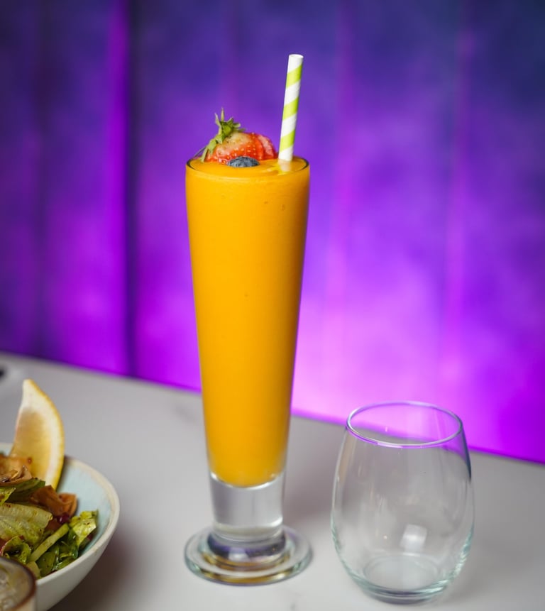 Fresh mango juice drink commercial beverage photography