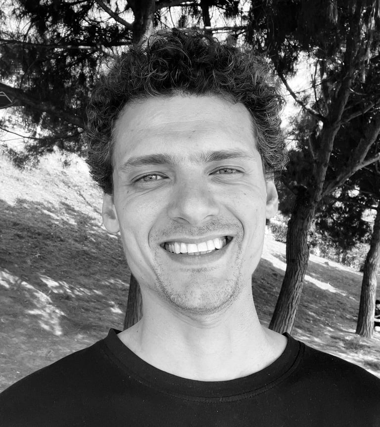 Aybars Düzey, Tai Ji and Qi Gong instructor at WDP Türkiye, smiling outdoors in natural light.