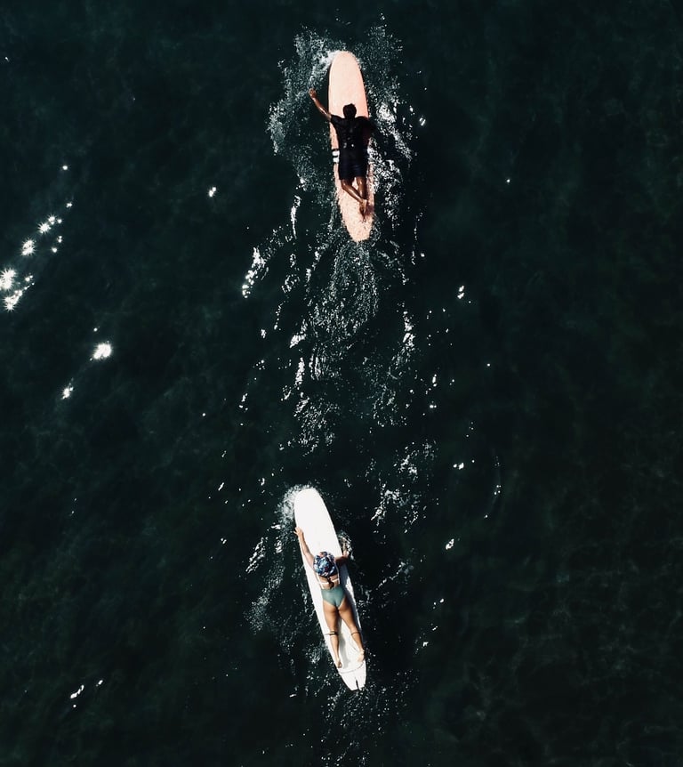 aerial drone view of surfers in batukaras
