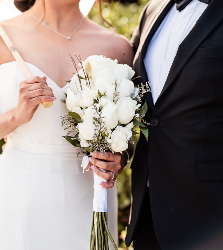 a bride and groom standing next to each other