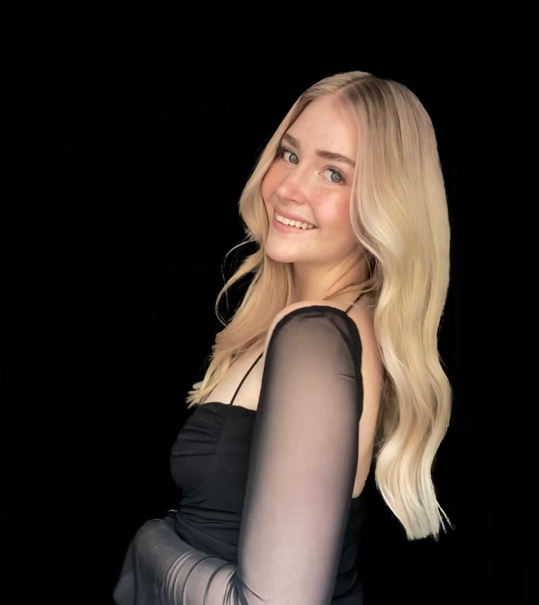 Nicole fine line tattoo artist creating elegant feminine tattoos at Aura Tattoo Studios