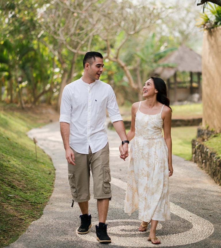 Intimate couple walking inside Waka Gangga resort garden in Tabanan West Bali