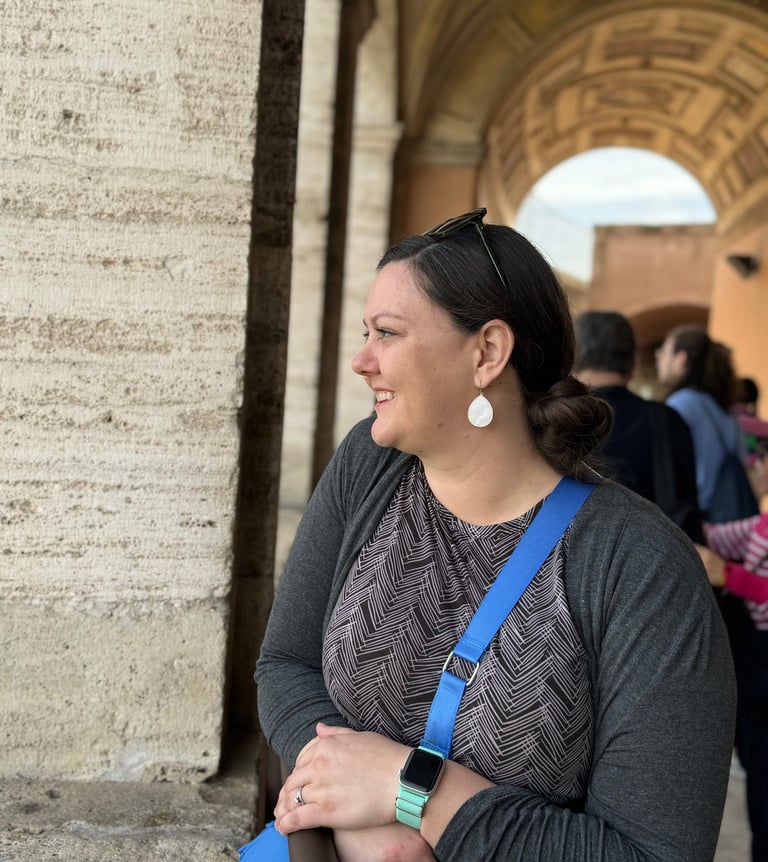 A woman standing atop Castel Sant'Angelo in Rome, Italy