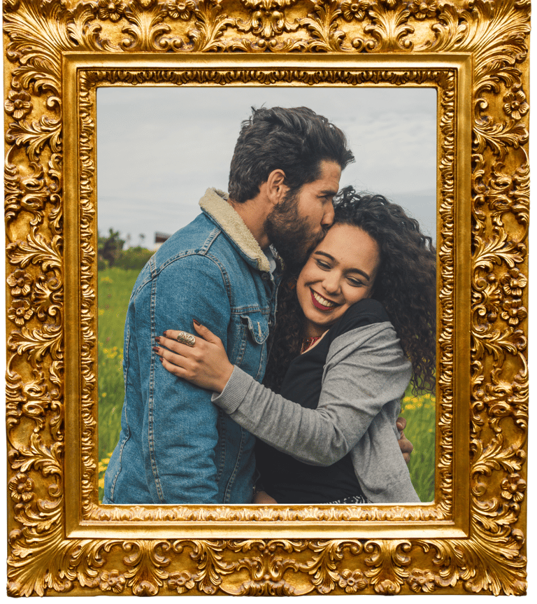 a couple embracing each other in a golden frame