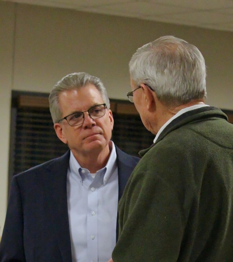 Dale Usher talking with a resident of Graves County