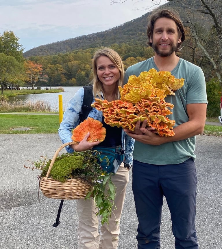 Owners 2123 rivermont holding mushrooms and a basket of mushrooms