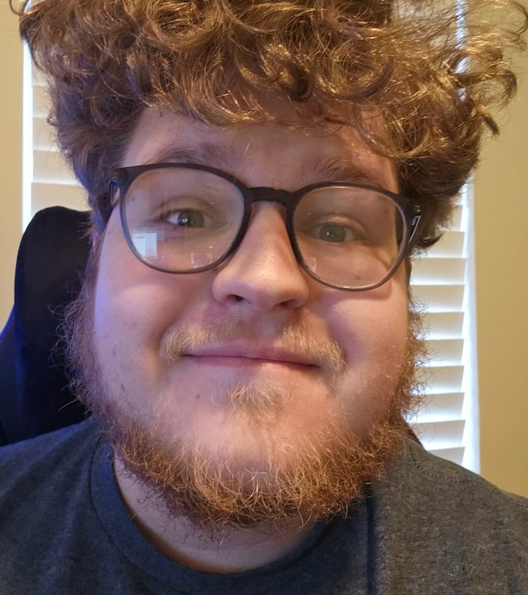 a man with a beard and glasses on his head