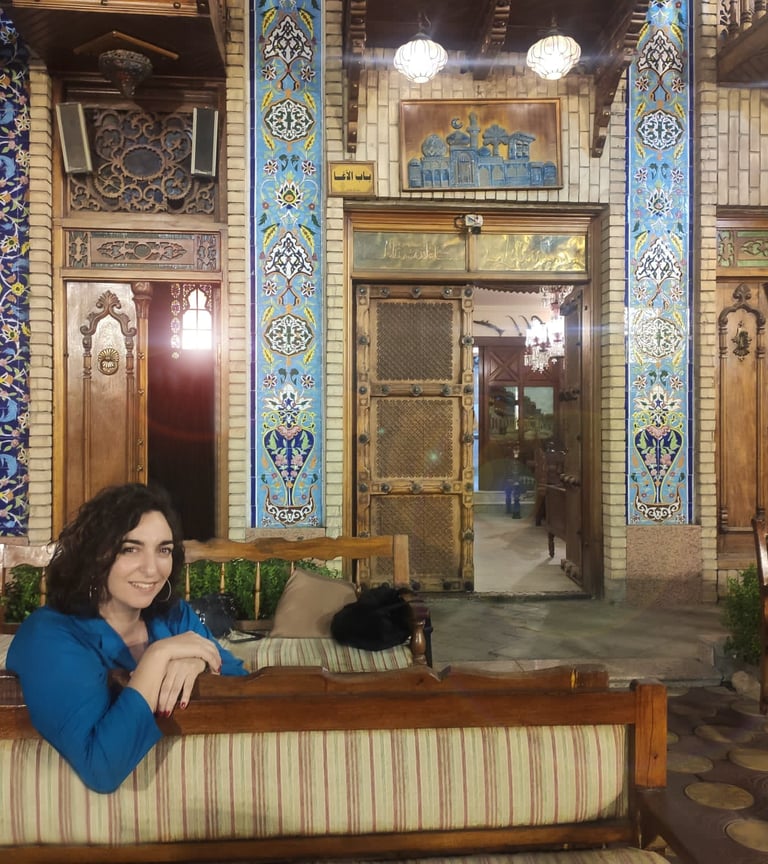 a woman sitting on a couch in a room