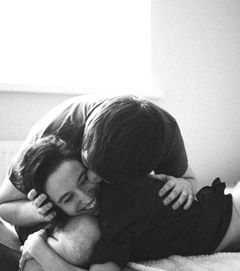 a man and woman who met on piano piano, kissing on a bed