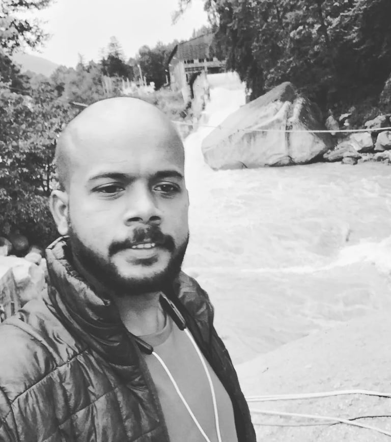 Founder of Rightbrainz media solutions a man with a beard and a beard in a black and white photo