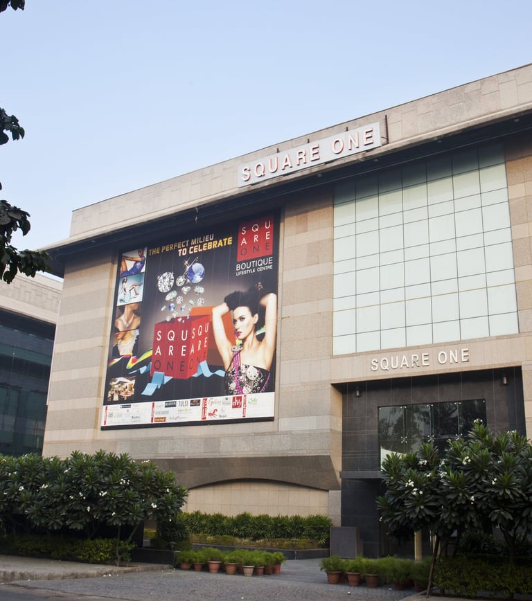 a building with a large poster on the side of it which says square one
