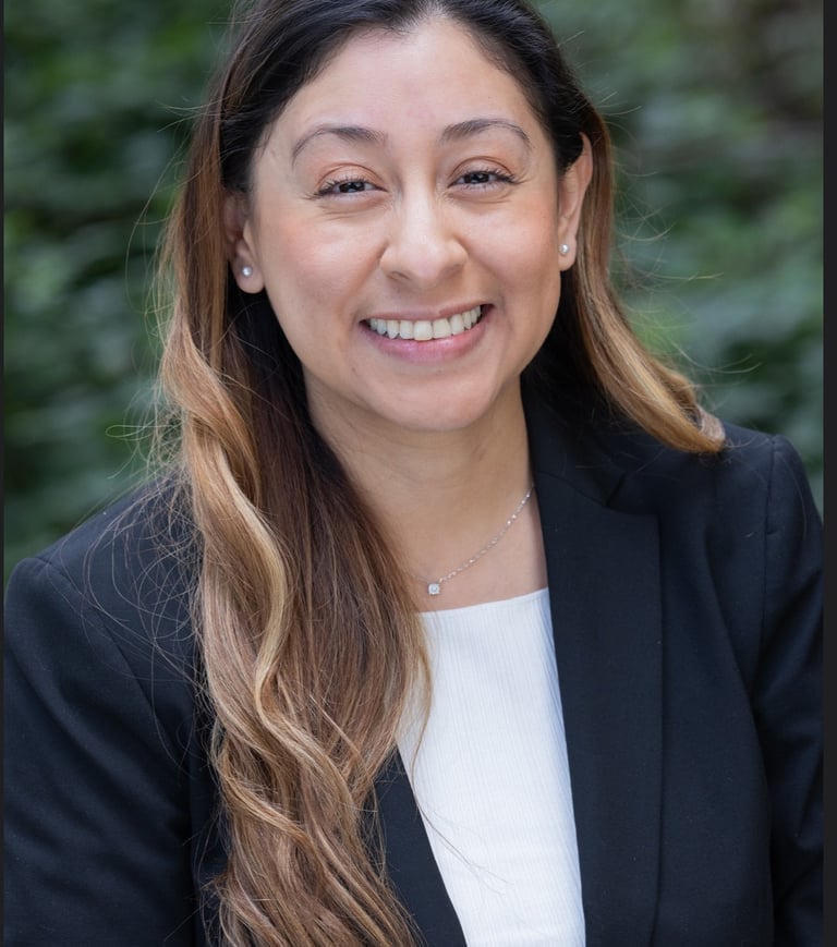 a woman in a black suit and white shirt