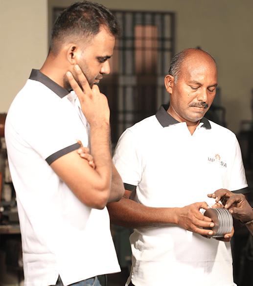 MP Asia Engineering staff checking a CNC precision tool
