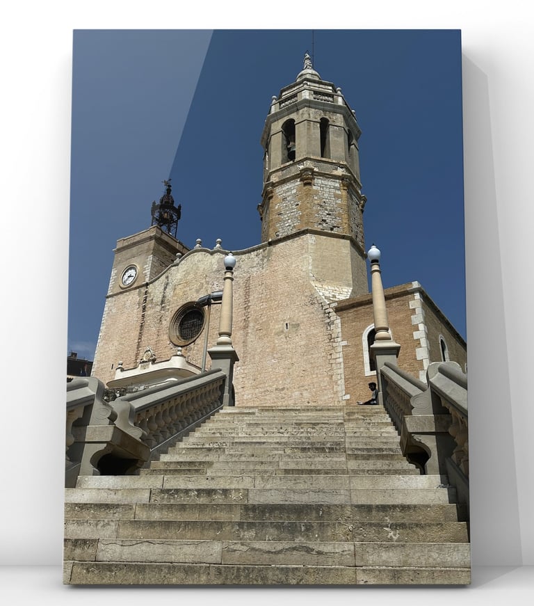 Photograph of Sant Bartomeu and Santa Tecla Church in Sitges, Spain, overlooking the Mediterranean w