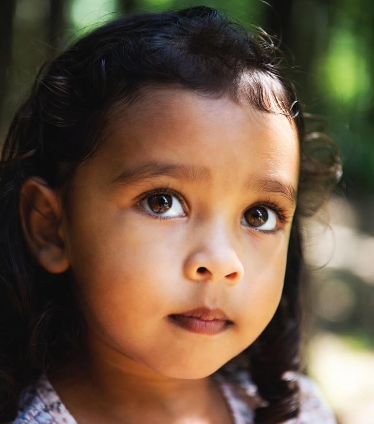 Young girl with selective mutism looks upwards.