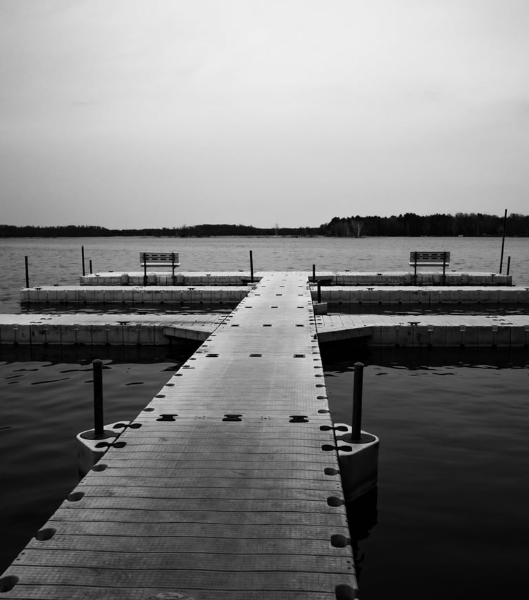 a dock with benches and benches in the water