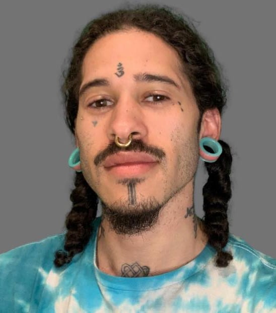 a man with a mustache and a mustache with a mustache on his face DOyen Fraser Jr.