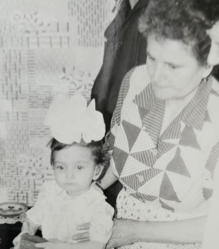 a woman holding a toddler 