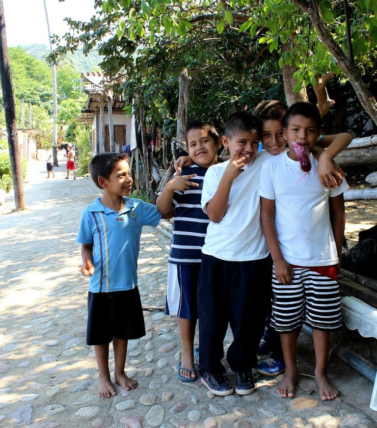 a group of children wait for the bus in Puerto Vallarta